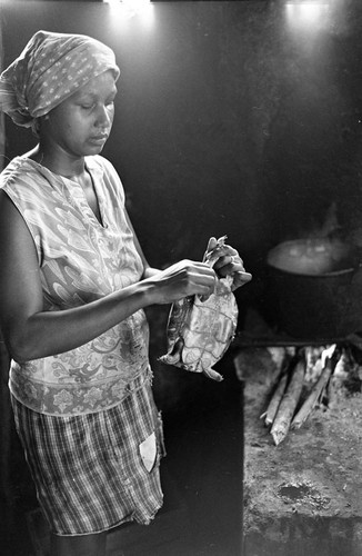 Woman cooking a turtle, San Basilio de Palenque, 1977