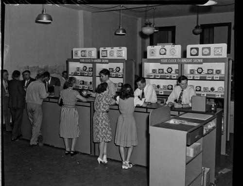 Customers exchanging old clocks for new ones during the frequency change at special depots like this one in Santa Barbara
