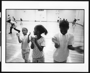 Children on a basketball court, 1996