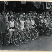 McCurry's photo of group of girls with bicycles and firemen posed in front of the Fox Senator Theater