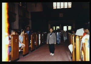 Children walking down the aisle in an unidentified COGIC church