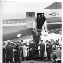 President Lyndon B. Johnson at the bottom steps of Air Force One on a 1964 campaign visit to Sacramento. Behind him are California Senator Pierre Salinger, a secret service agent, and Rep. Morris Udall of Arizona