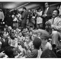 Jesse Jackson, the civil rights activist, founder of Rainbow/PUSH, and Baptist minister who ran for president in 1984 and 1988 and served as the first U.S. Shadow Senator from D.C. He is at the Del Paso ECE Center surrounded by kids