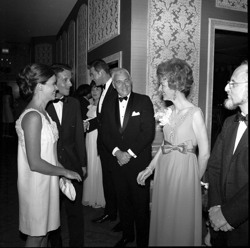 UCSD Chancellor William J. (William James) McGill (center) in the receiving line at the UCSD Faculty Ball. April 25, 1970