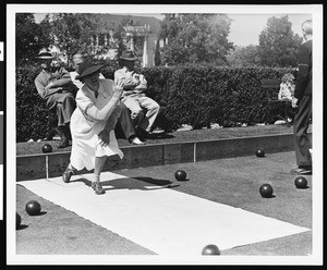 Close-up view of a female lawn bowler, ca.1930