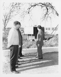 Hugh Codding and three unidentified men at the Pepsi Cola Bottling Plant being built by Codding Enterprises, Santa Rosa, California, 1959