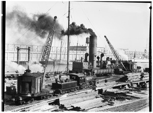 Cranes unloading steel at Los Angeles Harbor, January 1929
