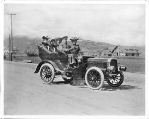 Group of motorists driving an early automobile along Hollywood Boulevard, Hollywood, ca.1903