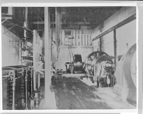 The interior of Mill Creek #1 Hydro Plant. showing the generators. the switchboard. and the Pelton wheels