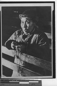 A woman praying at Manchukuo, China, ca.1930