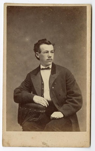 Portrait of seated unidentified man