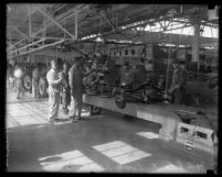 Workers on the assembly line at Ford Motor plant in Long Beach