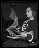 Actress Merle Oberon reviewing court papers in suit by her former attorney, Lyle W. Rucker, Calif., 1938