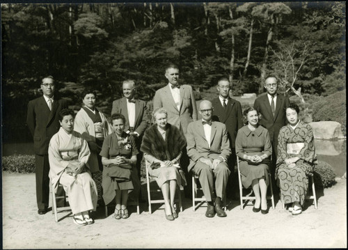 Charles Protzman and his wife with a group of people and Bunzaemon Inoue