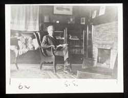 Luther Burbank Seated Reading in Tupper Street House, 1915