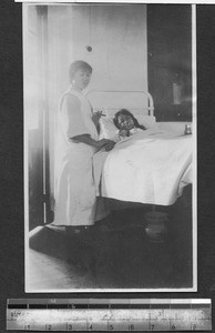 Sick girl with nurse, Shanghai, China, ca.1925