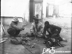 African man casting bones for divination, Pretoria, South Africa, ca. 1896-1911