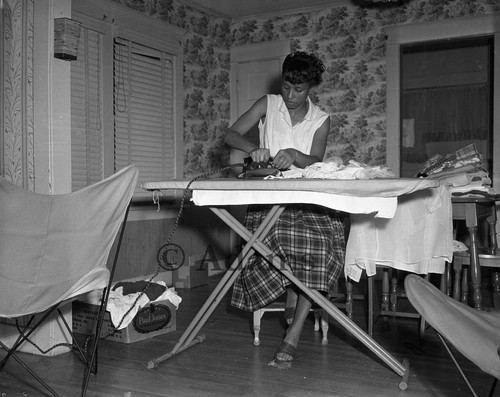 Woman ironing, Los Angeles, 1956