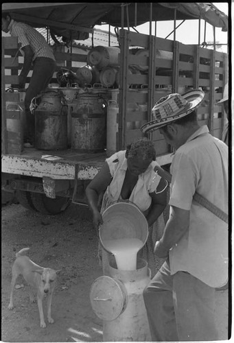 Woman pours milk into a pot, San Basilio de Palenque, 1975