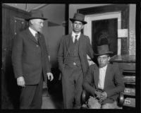First National Bank robbery suspects Salvadore Mendivil and Brulio Galindo with Deputy Sheriff A.L. Manning, 1922