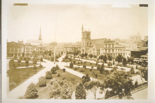 Union Square looking northwest across plaza. Calvary Presbyterian Church, far left; dressmaking shops; First Congregational Church spire, left. (Whole block now occupied by St. Francis Hotel.) Trinity Episcopal Church, northeast corner Powell & Post. National Guard Armory, white castle-like building, right