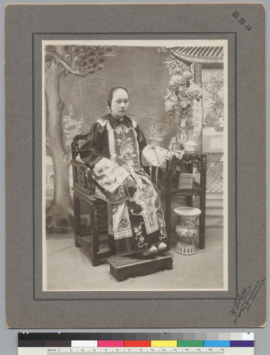 [studio portrait of woman in holiday dress]