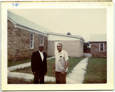 Herman Bousley and William Watts standing out of C.M.E. church, Lodi, Texas