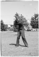 LA Daily News city editor Charles Judson demonstrates improper golf swings for a tutorial series with golfer Fay Coleman. Circa 1940