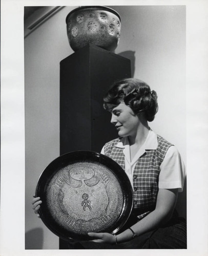 Woman with ceramic plate, Scripps College