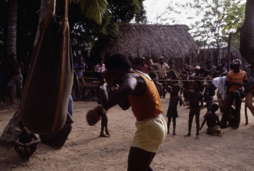 Boxer working out on a punching bag, San Basilio de Palenque, 1976