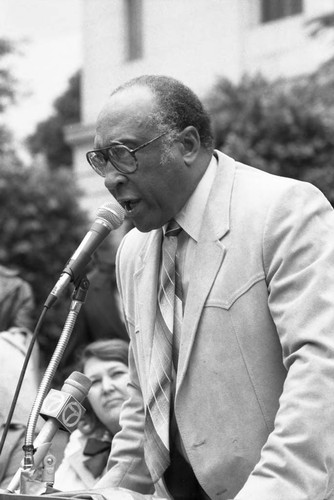 Bishop H. H. Brookins addressing a crowd in front of City Hall, Los Angeles, 1986
