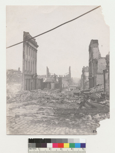 [Street scene showing rubble and ruins, unidentified location. No. 5 (... illegible; corner torn).]