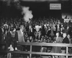Horsetrader Ed of San Francisco and crowd at Leghorn game, Petaluma, California, Oct. 7, 1950