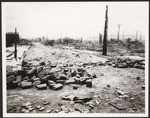 [Earthquake and fire damage along unidentified street]