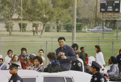 Muhammad Ali participates in San Bernardino's Black History Parade, [graphic]