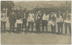[Line of men holding newspapers in Atascadero, San Luis Obispo Co.]
