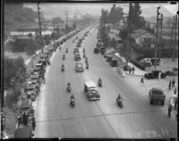 Crowds line the road to greet President Franklin D. Roosevelt’s motorcade, October 1, 1935