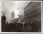 [Crowd on Market Street during fire. Call Building, left center; James Clair Flood Building, right]