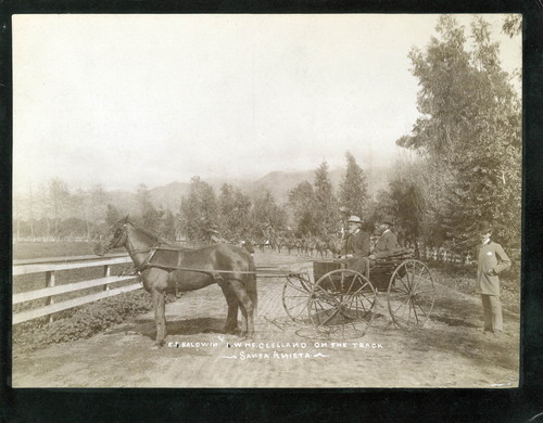 Elias J. "Lucky" Baldwin and horse trainer W. McClelland in Horse-drawn Buggy