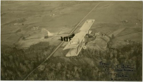 Charles E. Butner piloting biplane