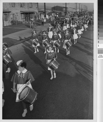 Photograph of parade at Basilone Homes