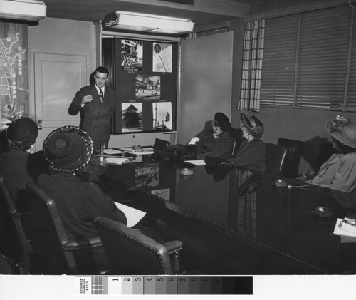 Photograph of Los Angeles Housing Authority official Frank Wilkinson during a presentation