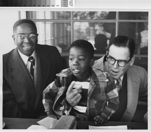 Photograph of George A. Beavers (left) and Mayor Norris Poulson with a child at Aliso Village Nursery School