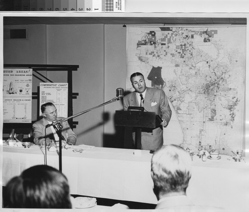 Photograph of Howard Holtzendorff delivering lecture on blighted and non-blighted areas