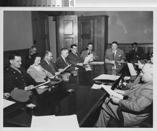 Photograph of staff meeting of City Housing Authority