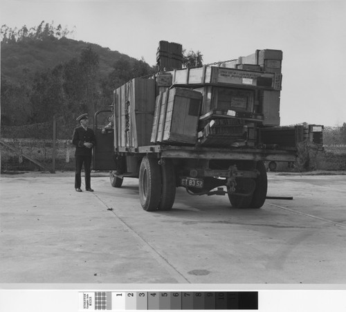 Photograph of truck carrying construction supplies for Rodger Young Village