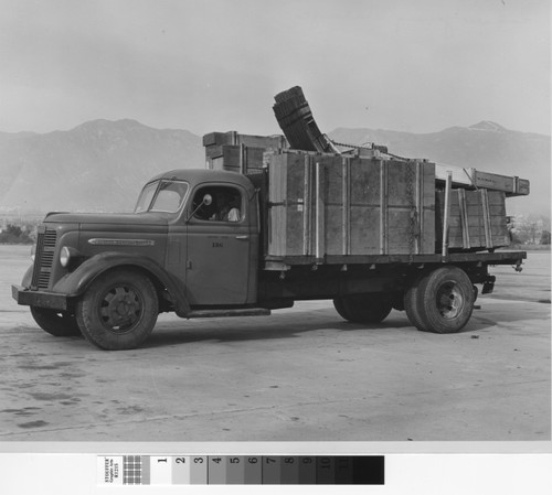 Photograph of truck transporting supplies for Rodger Young Village