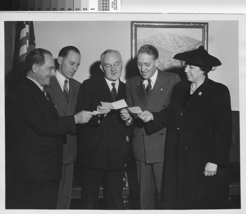 Photograph of presentation of taxes paid by Housing Authority of the City of Los Angeles