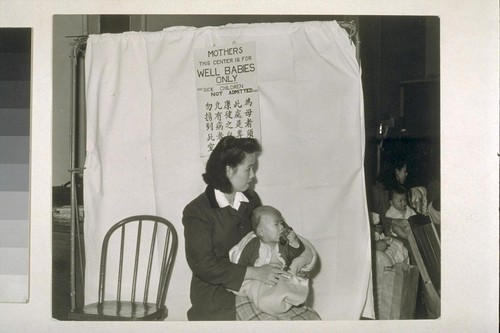 [Woman with infant at child care center.]