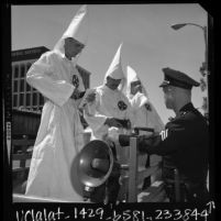 Police Sgt. Ronald Trauig with three Ku Klux Klan members in Panorama City, Calif., 1966